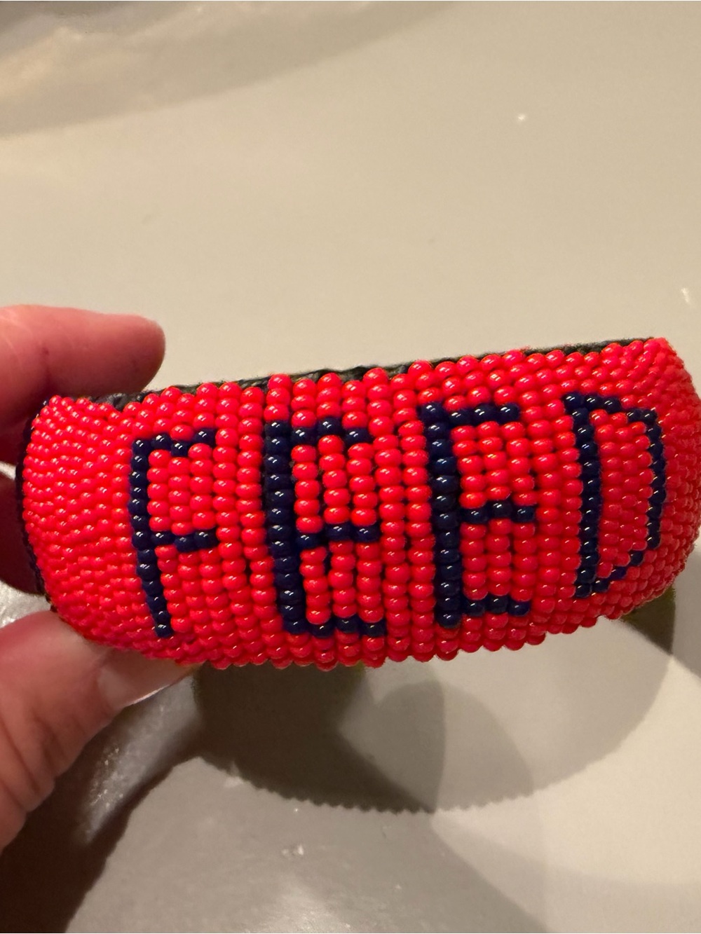Red Beaded 'FEED' Bangle Bracelet